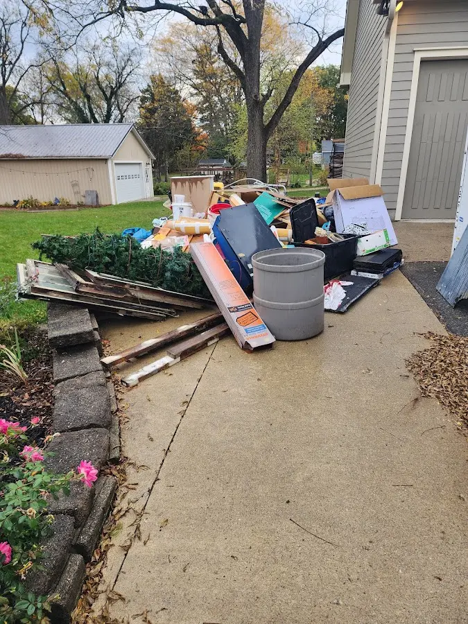Dumpster being loaded with debris for Commercial Dumpster Rental in Riverbank